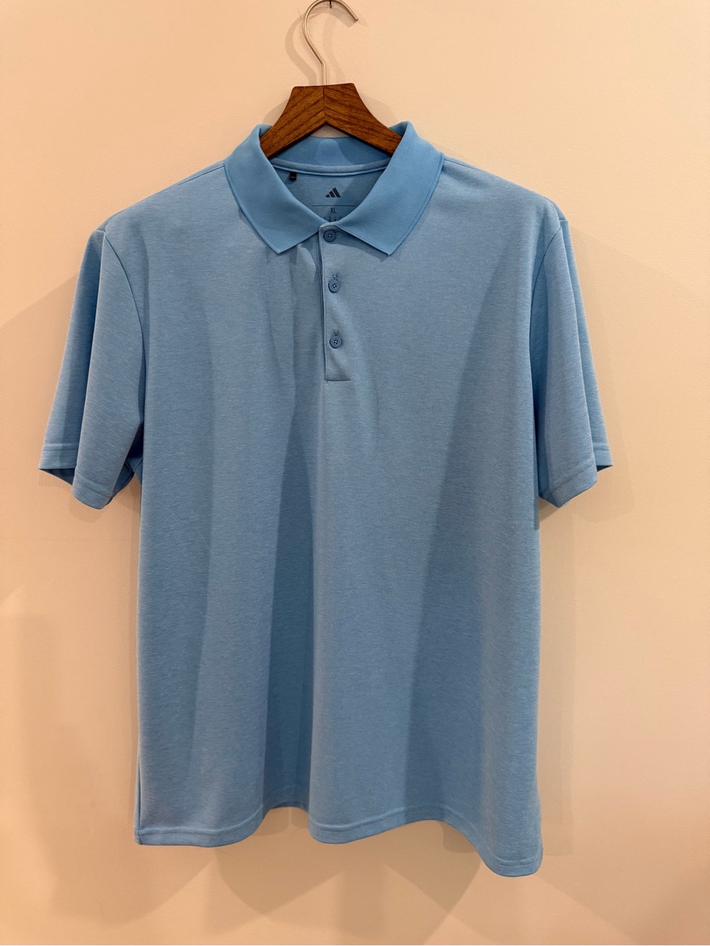 Adidas polo in light blue. Classic, clean look with soft stretch fabric